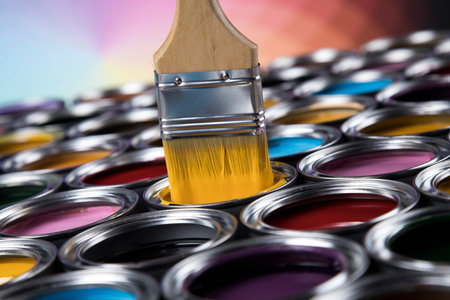 Colorful paint cans with paintbrush