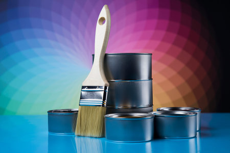 Tin cans with paint, brushes and bright palette of colorsの写真素材