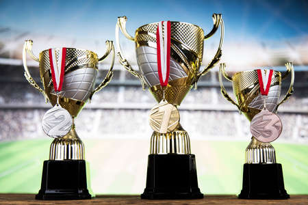 Award winning and championship concept, trophy cup on sport backgroundの写真素材