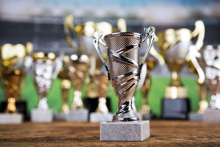 Award winning and championship concept, trophy cup on sport background