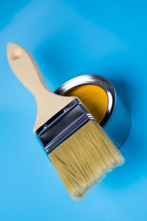 Tin cans with paint, brushes and bright palette of colorsの写真素材