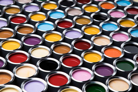 Group of tin metal cans with color paintの写真素材