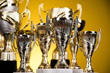 Award winning and championship concept, trophy cup on sport background