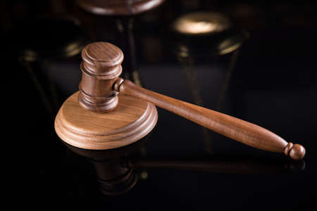 Law theme, mallet of the judge, mirror reflection backgroundの写真素材