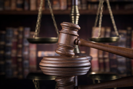 Law theme, mallet of the judge, justice scale, mirror reflection background