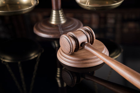 Law theme, mallet of the judge, justice scale, mirror reflection background