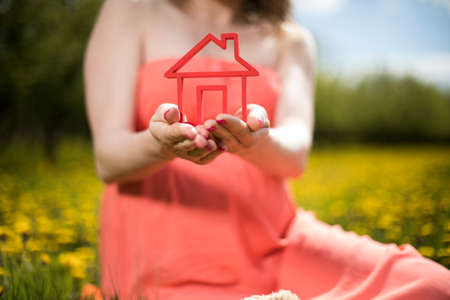 Home, pregnant woman in the meadowの写真素材