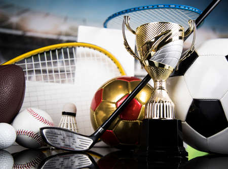 Cups of winners award on white podium, sport backgroundの写真素材