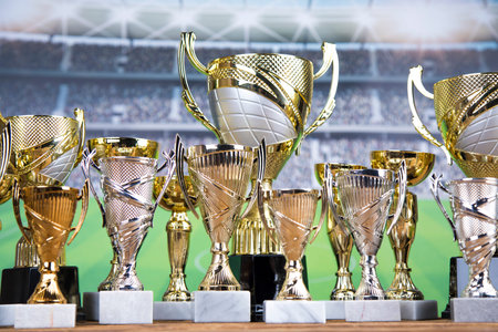 Award winning and championship concept, trophy cup on sport background