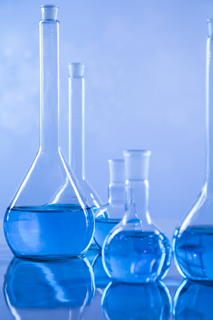 Laboratory beakers,Science experiment, blue backgroundの写真素材