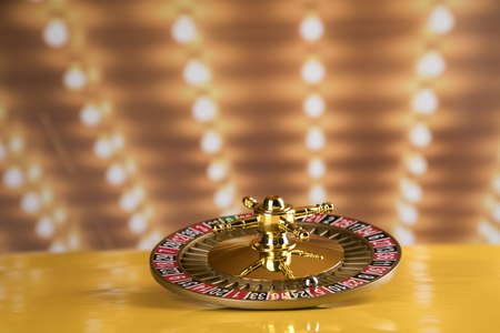 Gaming table, roulette wheel in motion, casino backgroundの写真素材