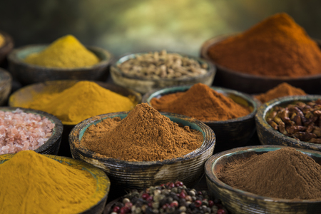 Variety of spices and herbs on kitchen tableの写真素材