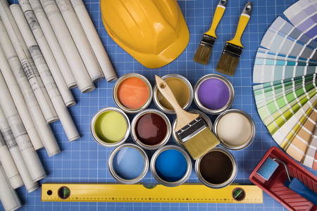 Colorful paint can,brush, blue backgroundの写真素材