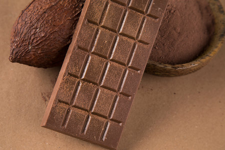 Milk and dark chocolate on a natural paper background