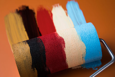 Metal tin cans with color paint and paintbrush