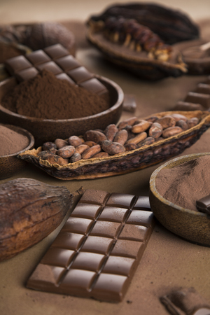 Aromatic cocoa and chocolate on natural paper backgroundの写真素材