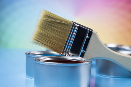 Tin cans with paint, brushes and bright palette of colorsの写真素材