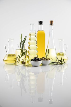 Olive oil bottles, olive branch and Cooking oilsの写真素材