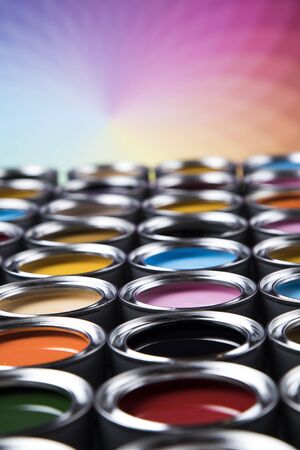 Group of tin metal cans with color paintの写真素材