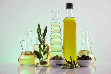 Olive oil bottles, olive branch and Cooking oilsの写真素材