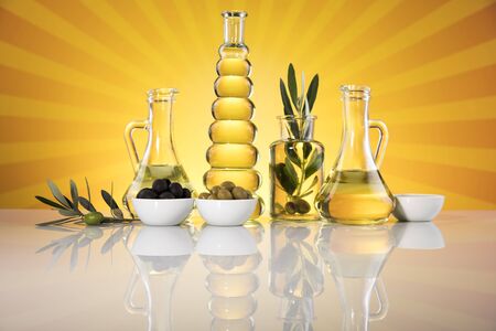 Olive oil bottles, olive branch and Cooking oilsの写真素材