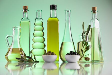 Olive oil bottles, olive branch and Cooking oilsの写真素材