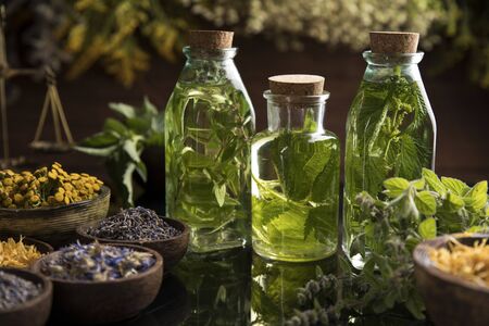 Oil and Natural medicine, wooden table backgroundの写真素材