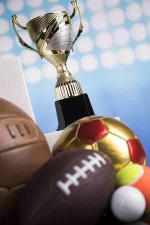 Trophy cup and sport ball backgroundの写真素材