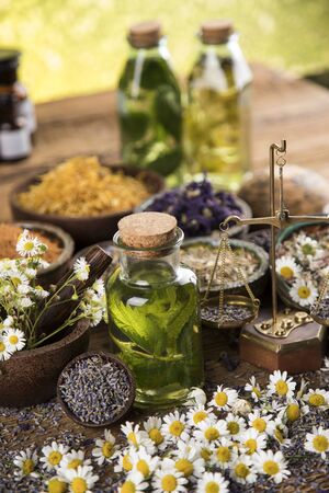 Oil and Natural medicine, wooden table backgroundの写真素材