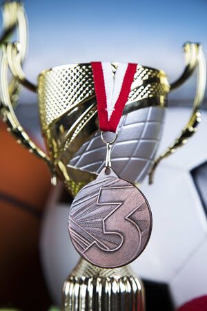 Trophy cup and sport ball backgroundの写真素材