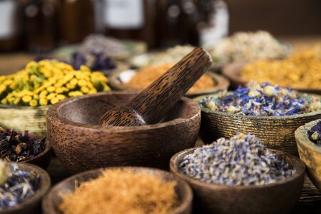 Homeopathy, herbal medicine on wooden tableの写真素材