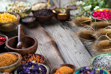 Homeopathy, herbal medicine on wooden table