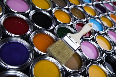Paintbrush on cans with colorの写真素材