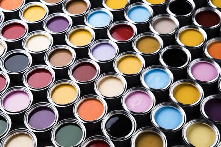Open buckets with a paint, colors backgroundの写真素材