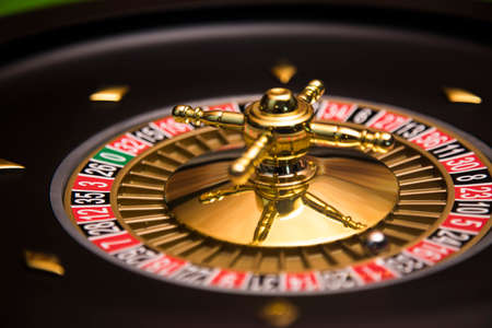 Roulette wheel in motion in a casino backgroundの写真素材