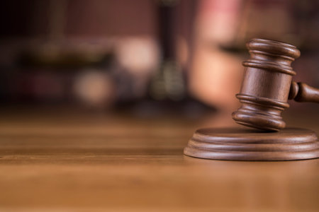 Law theme, mallet of judge, wooden gavel, globe backgroundの写真素材