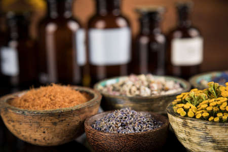 Alternative health, fresh herbal and mortar in black mirror backgroundの写真素材