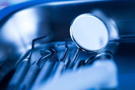 Dentist equipment on blue backgroundの写真素材