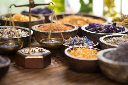 Natural medicine and mortar, healing herbs backgroundの写真素材