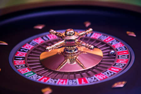 Roulette wheel in motion in a casino backgroundの写真素材