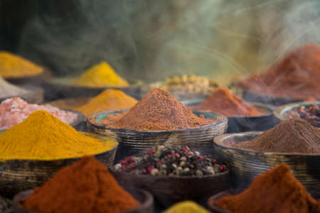 Spices and herbs in wooden bowl Colorful spicesの写真素材