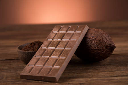 Chocolate bar, candy sweet, cacao beans and powderの写真素材