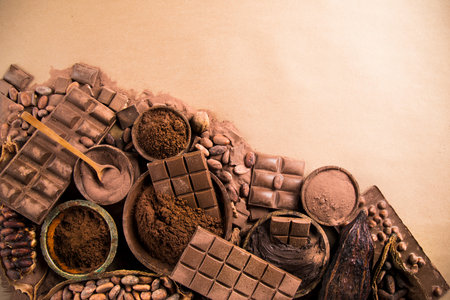Aromatic cocoa and chocolate on natural paper background