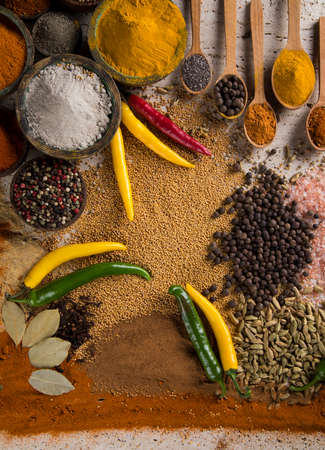 Assortment of spices in wooden bowl backgroundの写真素材