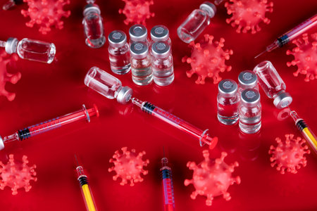 Bottles of Vaccine and syringe, pandemic backgroundの写真素材