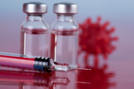 Bottles of Vaccine and syringe, pandemic backgroundの写真素材