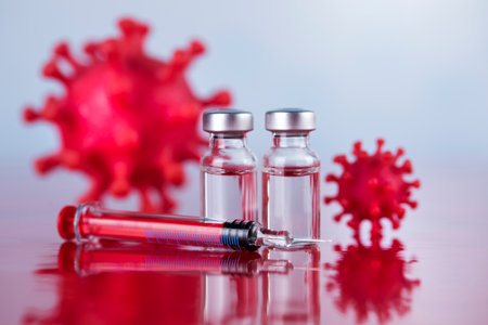 Bottles of Vaccine and syringe, pandemic backgroundの写真素材