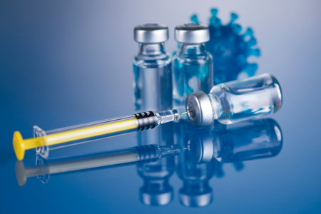 Bottles of Vaccine and syringe, pandemic backgroundの写真素材