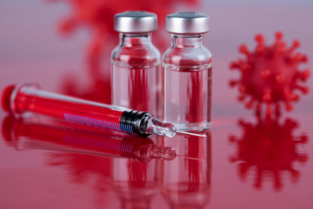 Bottles of Vaccine and syringe, pandemic backgroundの写真素材