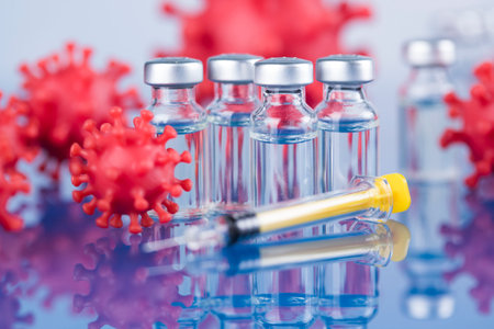 Bottles of Vaccine and syringe, pandemic backgroundの写真素材